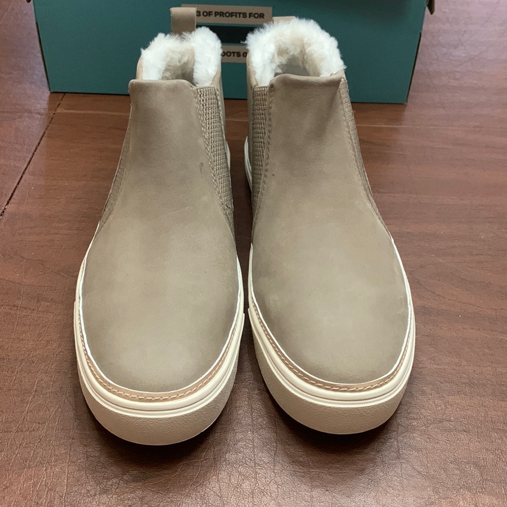 toms tan slip on high top sneakers with fluff inside. Size 9.5.